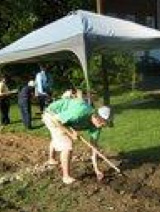 Digging in the soil at the community garden.
