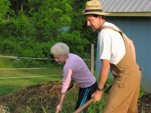 older lady and man working in garden